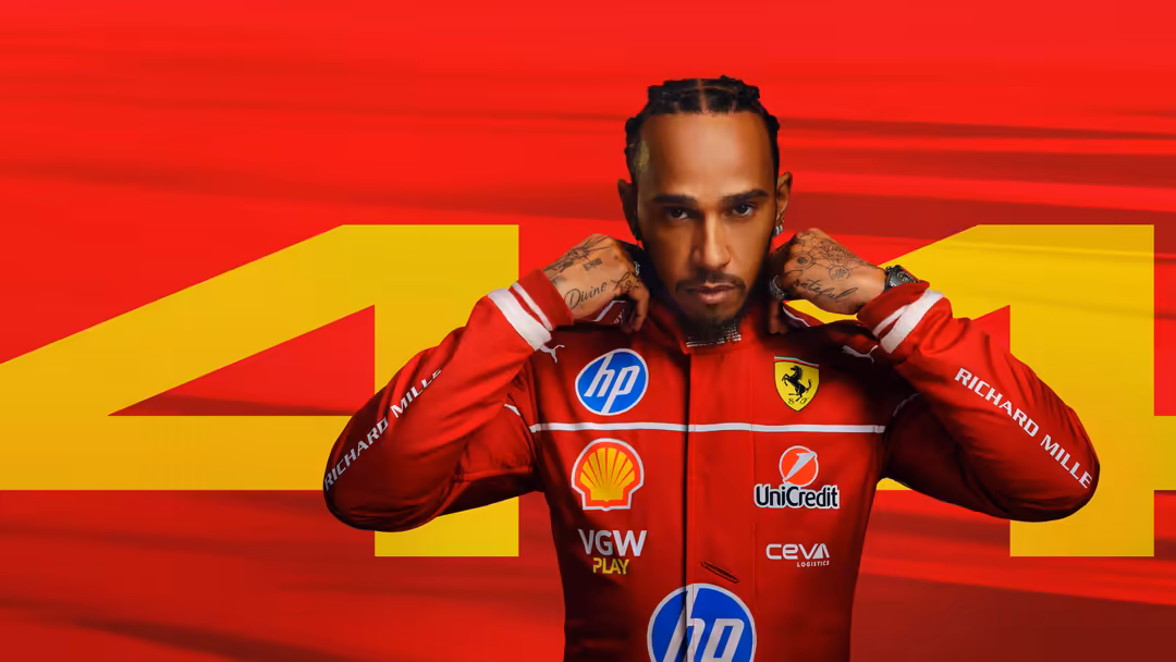 Professional F1 racing driver in red Ferrari suit with sponsors, posing confidently against bold red and yellow background