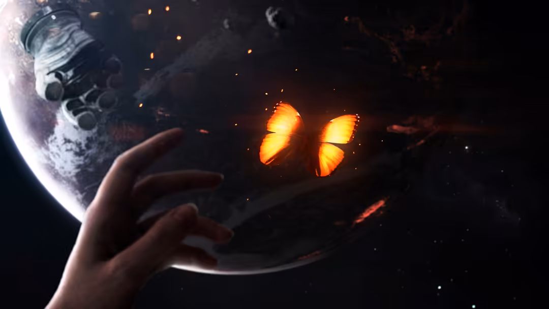 Hand reaching toward glowing golden butterfly against dark cosmic background with moon and floating particles