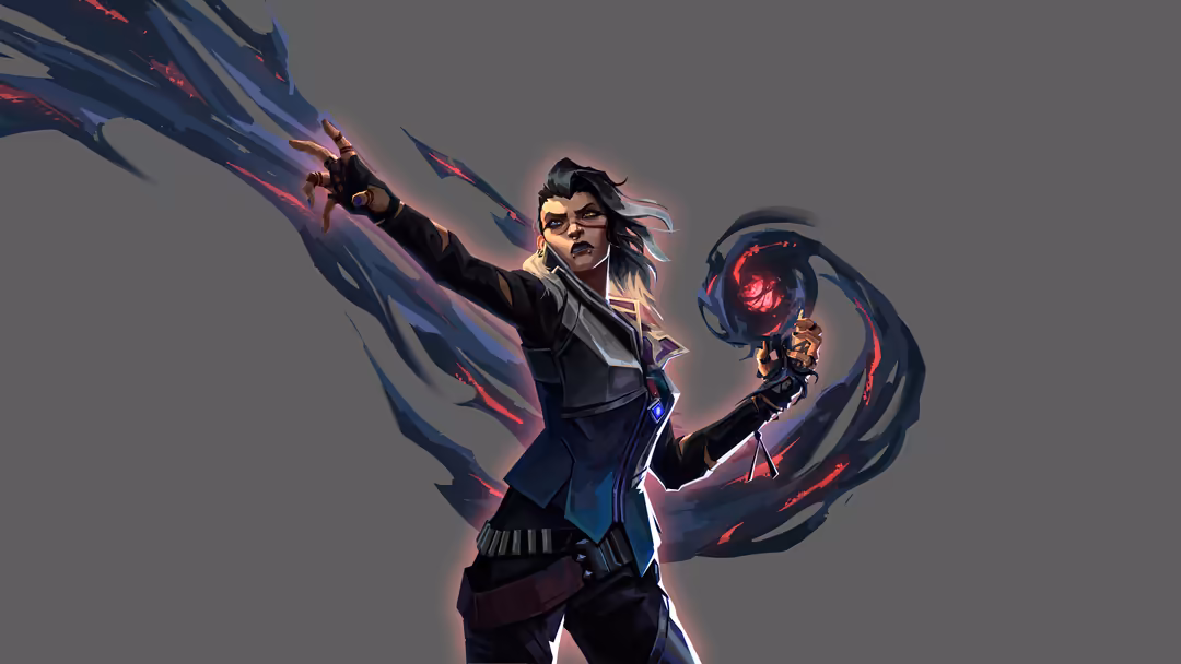 Fade from Valorant stands confidently with glowing red energy weapons, wearing black tactical outfit against grey background