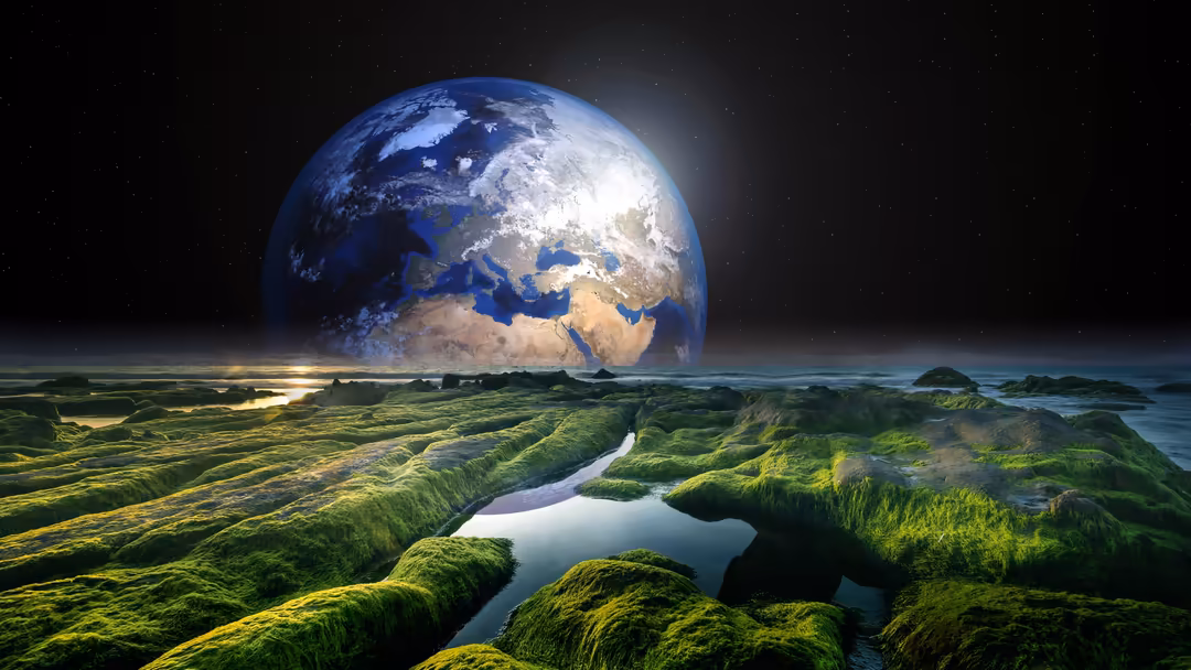 Earth looms large above a green moss-covered alien landscape with water channels under a starry night sky