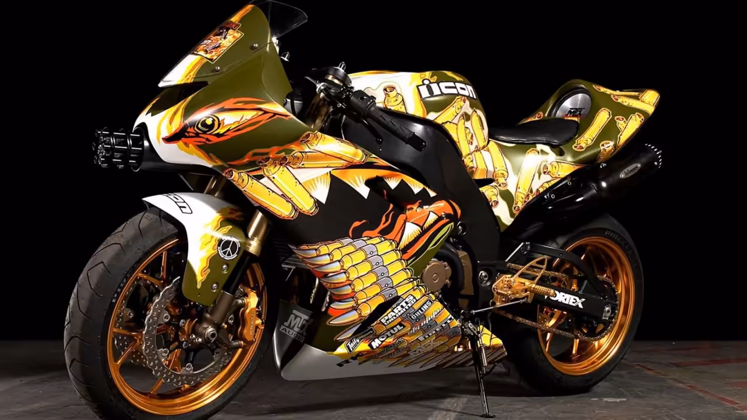 Custom sport bike featuring gold and orange dragon artwork with intricate details, black background, showcasing artistic moto