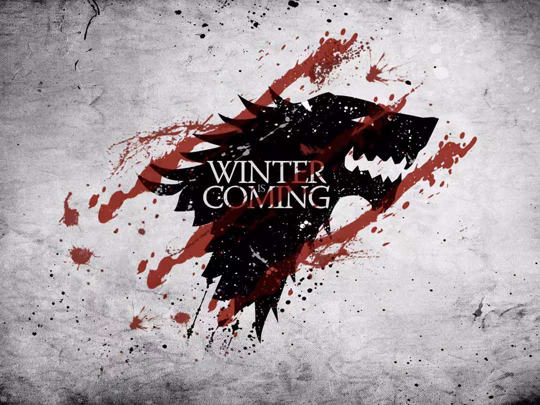 Dire wolf silhouette with winter coming text in bold lettering, featuring dramatic red blood splatter effects against a grey