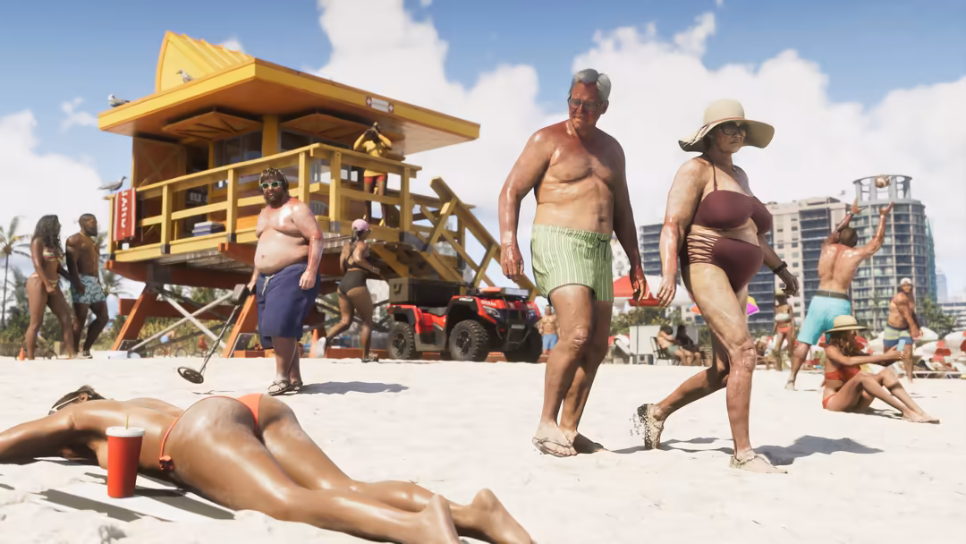 Beachgoers enjoy a sunny day near a yellow lifeguard tower with high-rise buildings in the background and clear blue skies.
