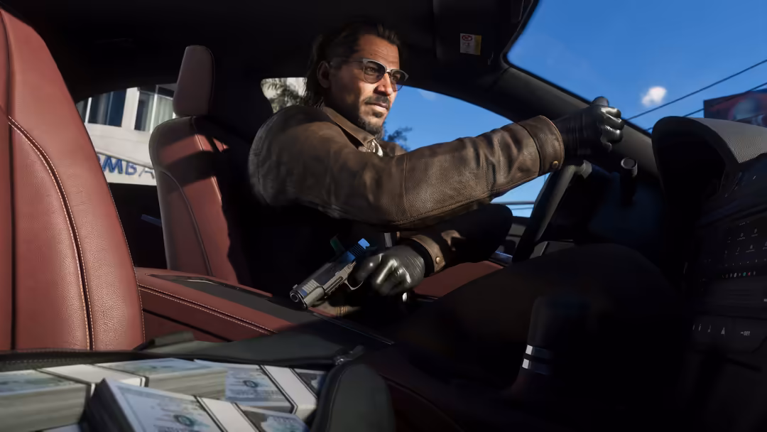 Man with glasses driving a car with red interior, holding a revolver, bright daylight visible through windshield