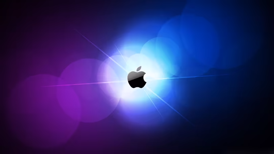 Glowing Apple logo centered on abstract background with blue and purple light rays and bokeh effects radiating outward