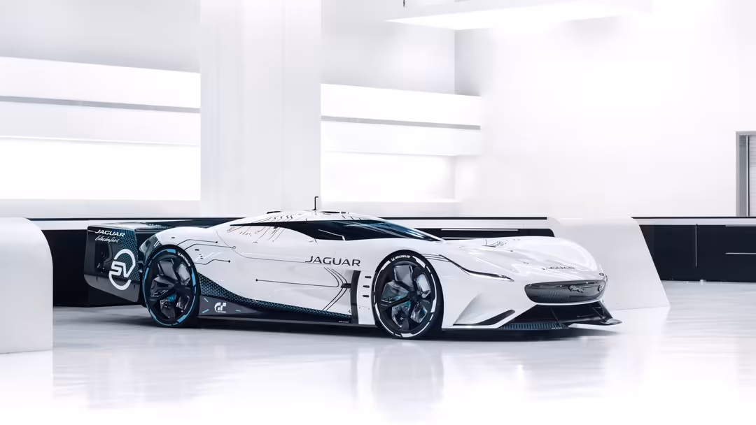 White Jaguar Vision Gran Turismo SV concept sports car displayed in modern minimalist white garage setting with sleek design
