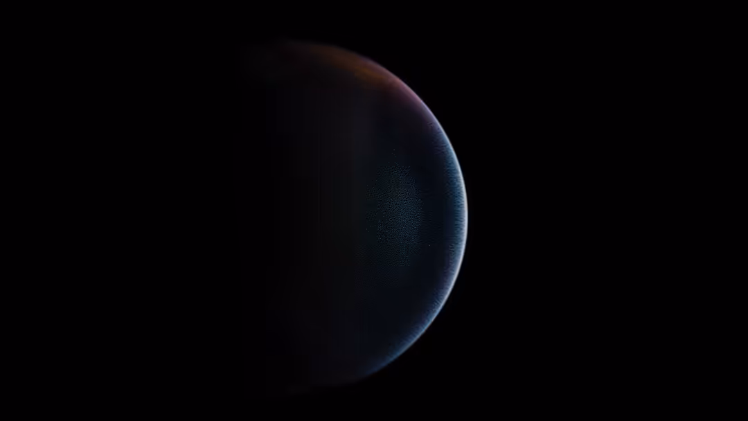 A dark planet with subtle blue and orange atmospheric glow outlined against a black cosmic void, minimalist space scene