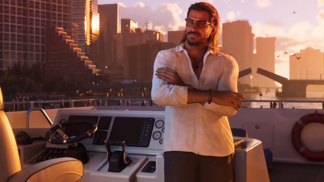 Man in white shirt on yacht deck at sunset with city skyline and bridge in background, golden hour lighting