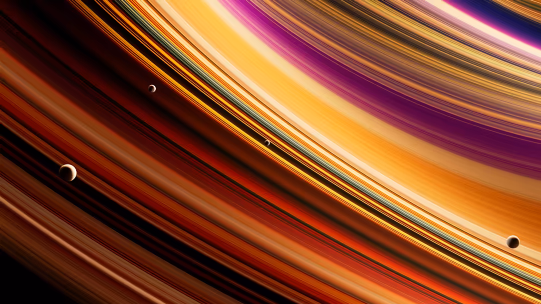 Abstract celestial scene with colorful rings, moons, and planets against a dark background with gold and purple gradients
