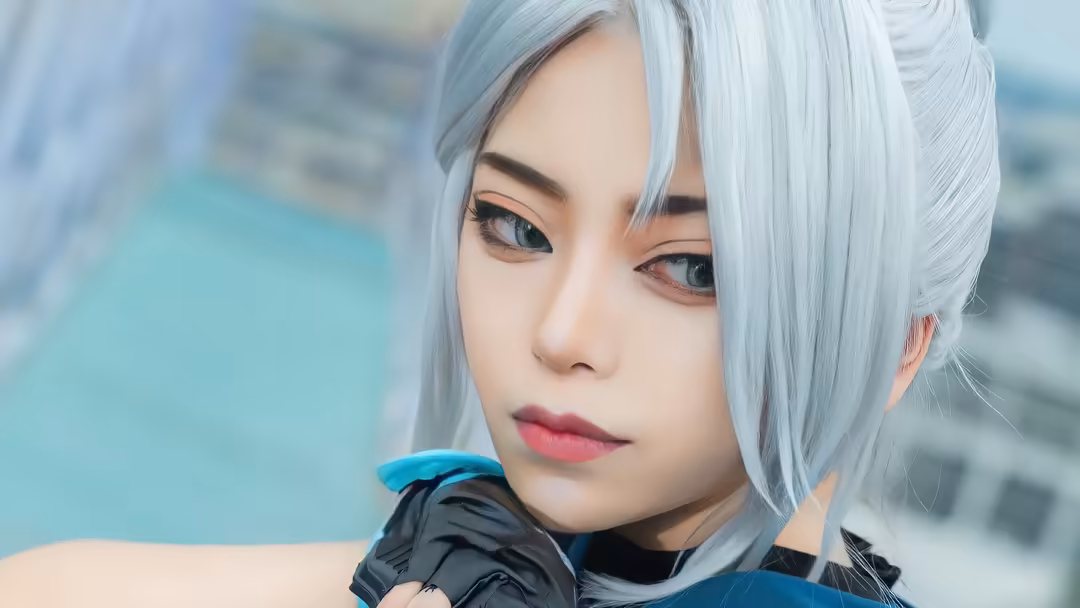 Silver-haired character with blue eyes wearing black and blue tactical outfit, detailed anime-style portrait with gaming aest