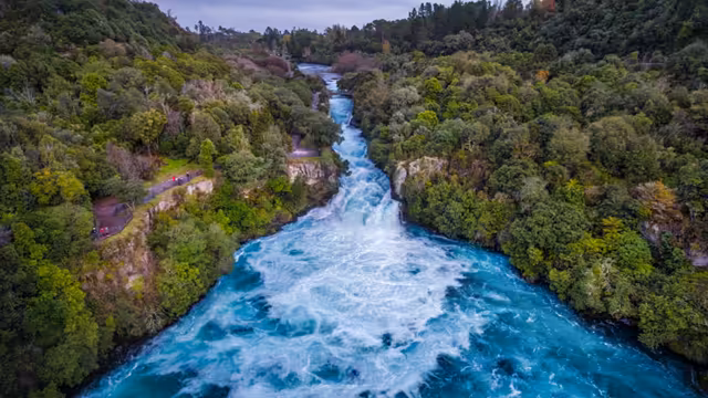 Turquoise River Flowing Through Forest