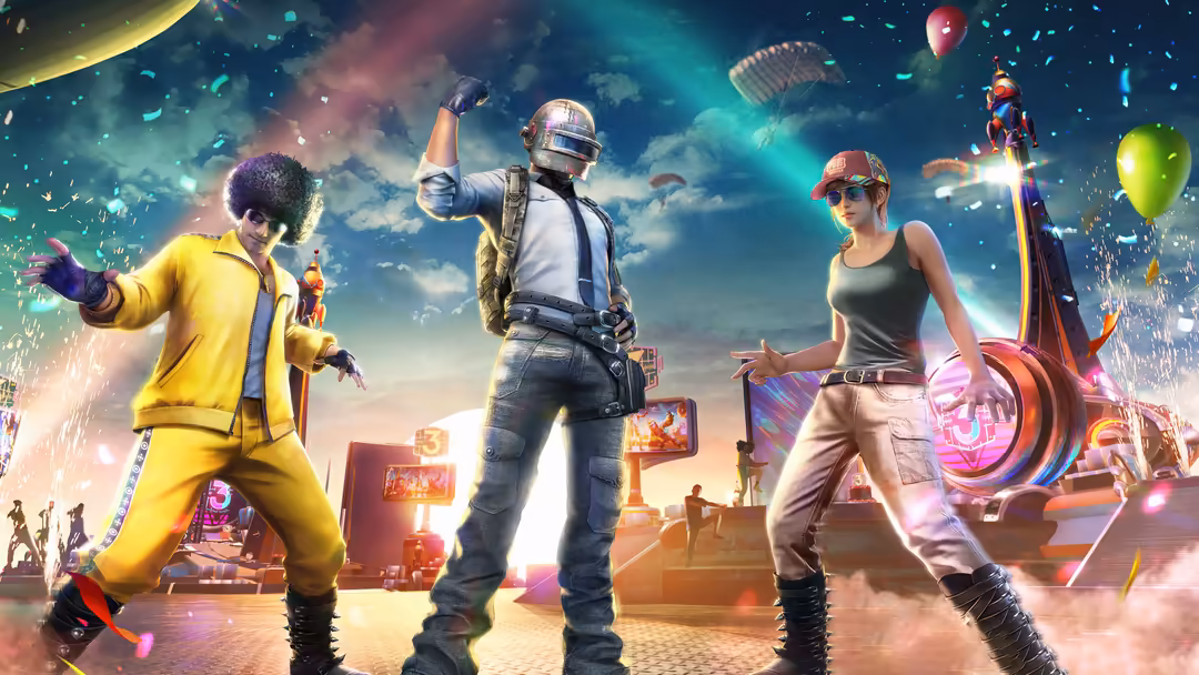 Vibrant PUBG scene with three armored players celebrating in neon-lit desert landscape with colorful balloons and explosive e