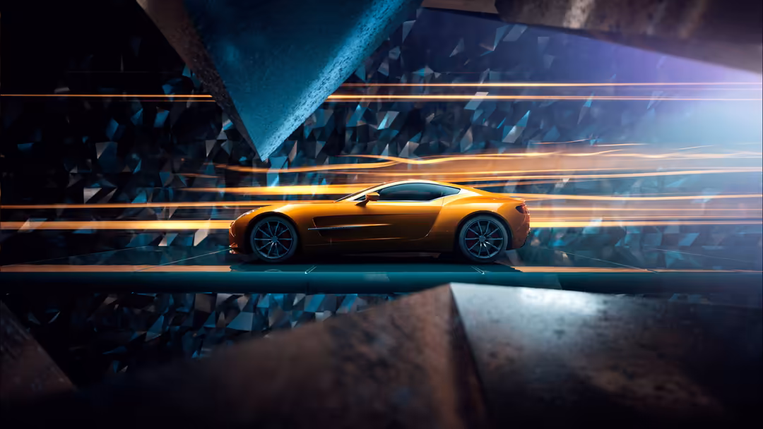 Golden Aston Martin One-77 luxury sports car on illuminated track with geometric blue and orange light trails