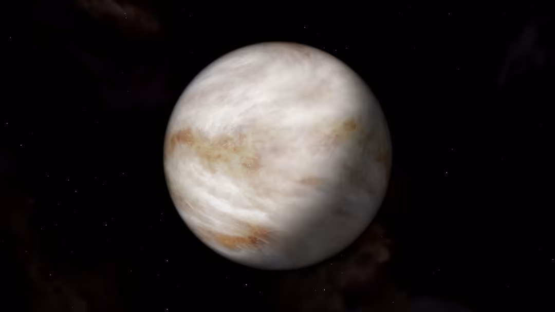 Detailed view of Venus with swirling white clouds and rusty surface features against the darkness of space