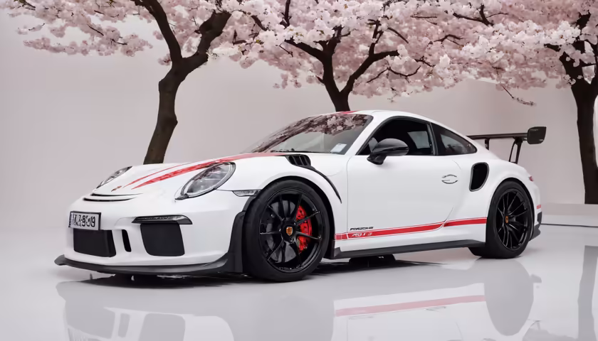 White Porsche Sports Car Cherry Blossoms