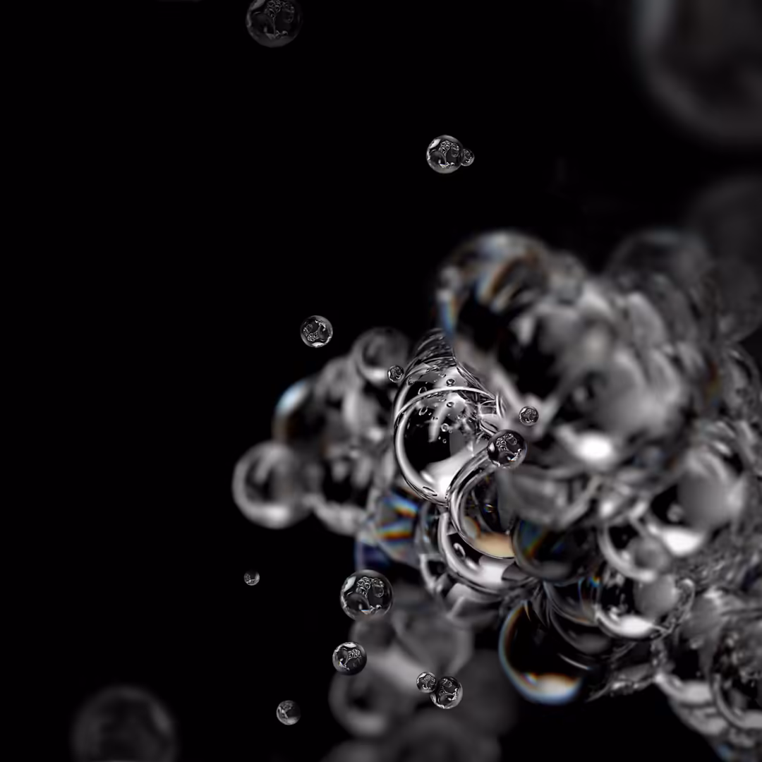 Translucent bubbles with iridescent reflections floating against a dark black background with blurred geometric shapes
