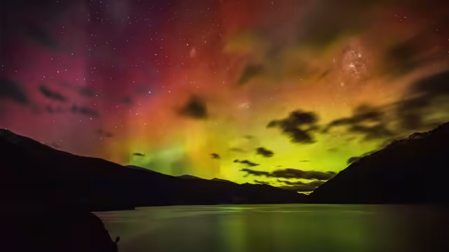 Aurora Borealis Over Mountain Lake