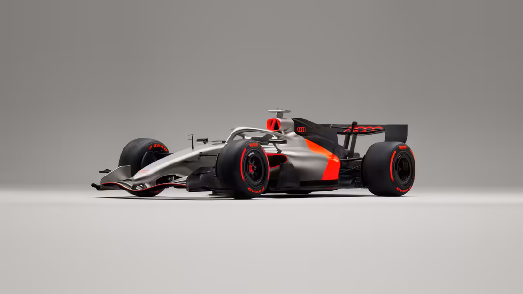 Modern Formula 1 racing car with red and silver livery, black accents, and red-rimmed wheels on neutral gray background