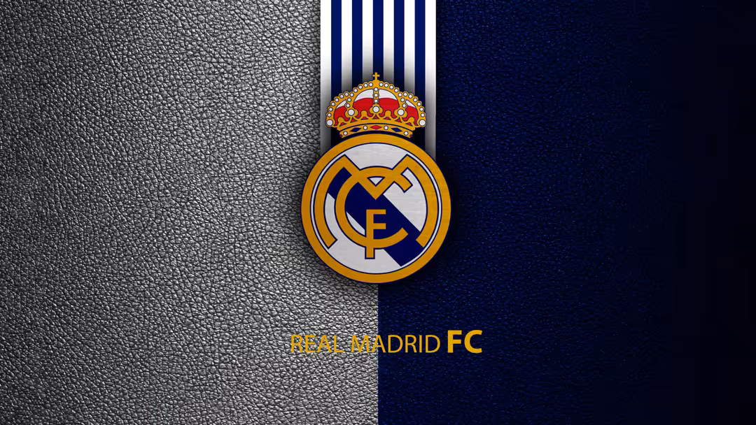 Real Madrid CF official crest logo with golden crown and royal emblem on split gray and navy blue textured background