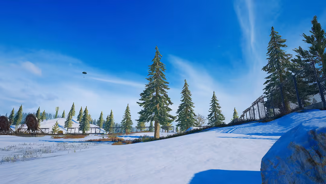 Snowy winter landscape with tall pine trees, frozen lake, and blue sky in a PUBG gaming environment