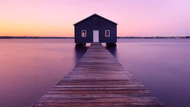 Serene Boathouse at Sunset