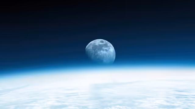 Moon Rising Above Earth Horizon