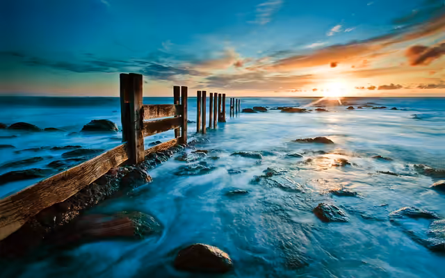 Weathered Pier Sunset Over Turquoise Ocean