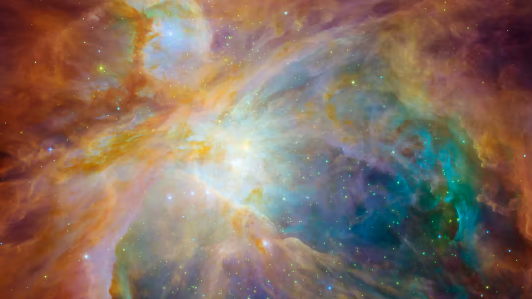 Vibrant cosmic nebula with swirling clouds of orange, gold, teal and purple gas illuminated by bright stars and stellar radia