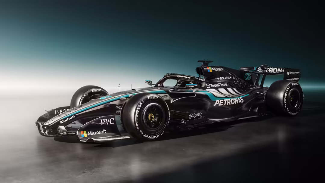 Black and turquoise Formula One racing car with sponsor logos on a gradient background, aerodynamic design with visible side