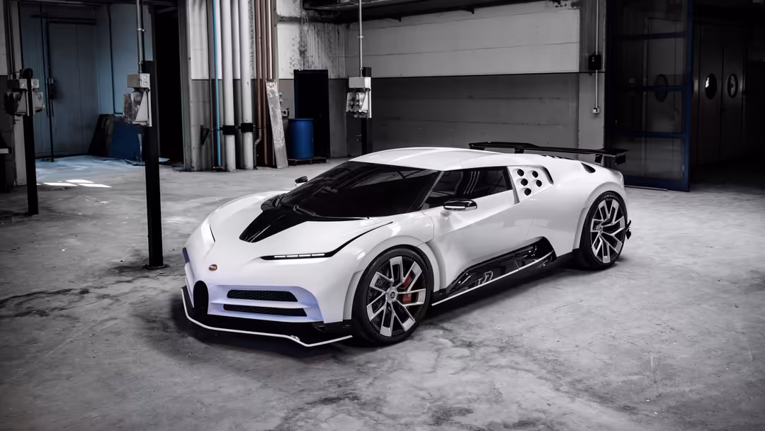 White Bugatti Centodieci hypercar parked in industrial garage with blue accents and polished alloy wheels