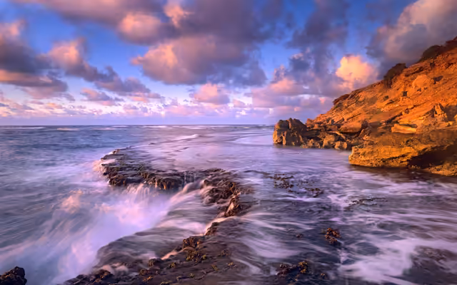 Rocky Coastal Sunset With Dramatic Sky