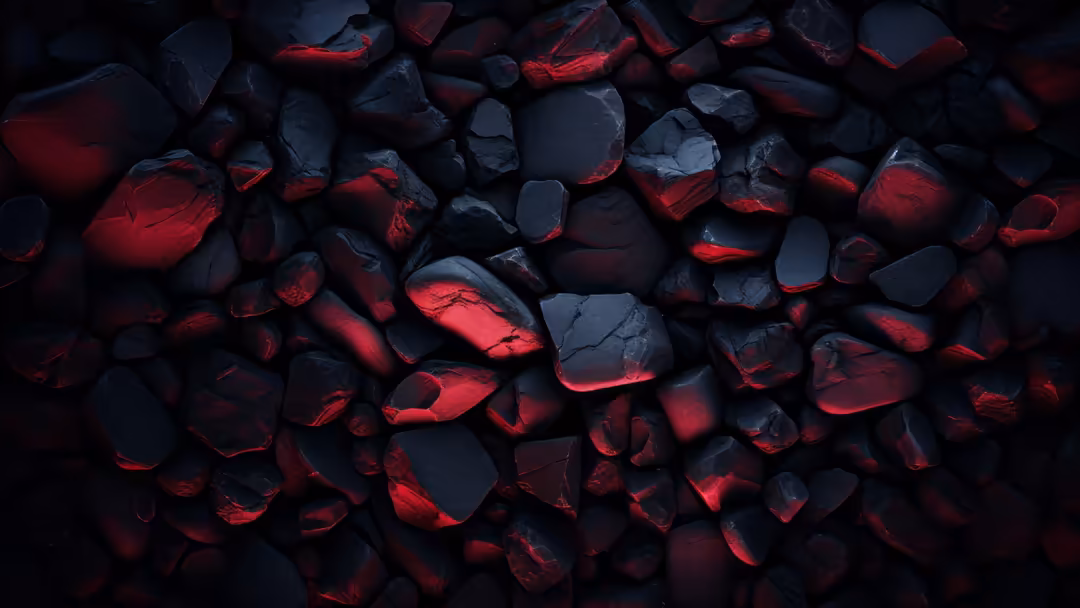 Dark abstract composition of black and charred rocks with vibrant red glowing edges and cracks throughout the textured surfac