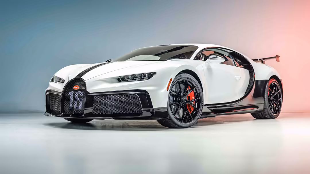White Bugatti Chiron Pur Sport hypercar with open door, red brake calipers, displayed against gradient blue and pink backgrou