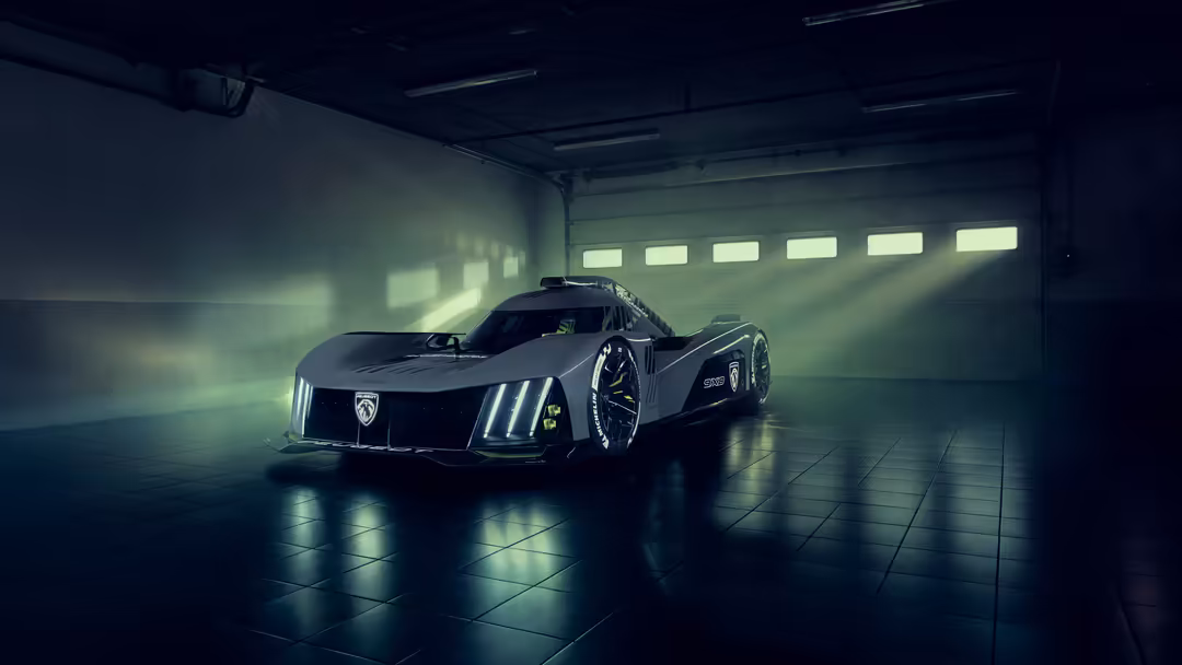 Sleek Peugeot 9X8 prototype supercar with illuminated grille in dark industrial garage with atmospheric lighting