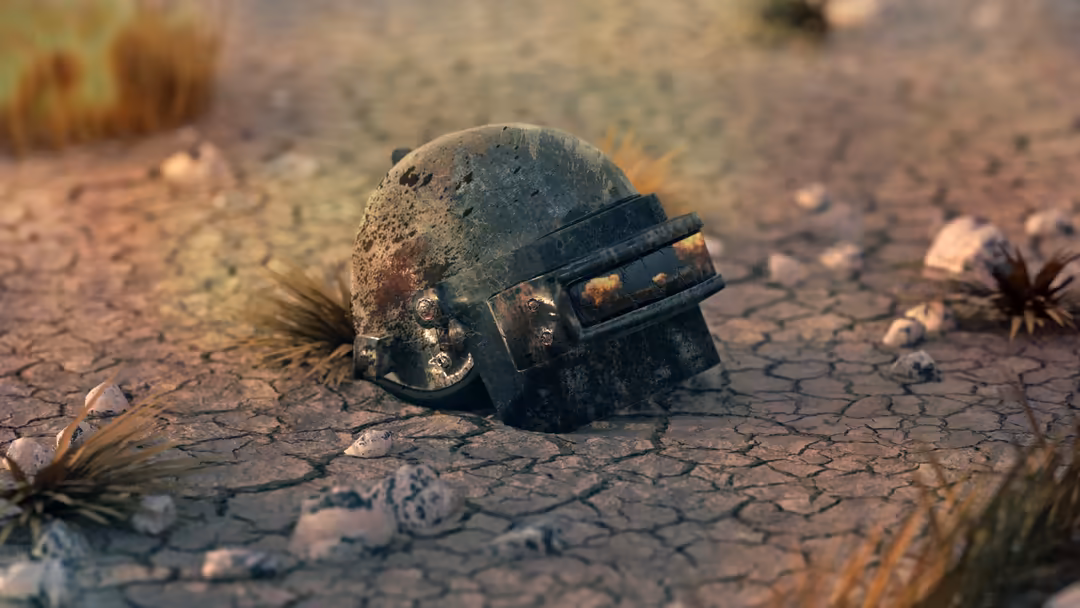 Abandoned military helmet lying on cracked desert ground with scattered debris and dried vegetation in a post-apocalyptic was