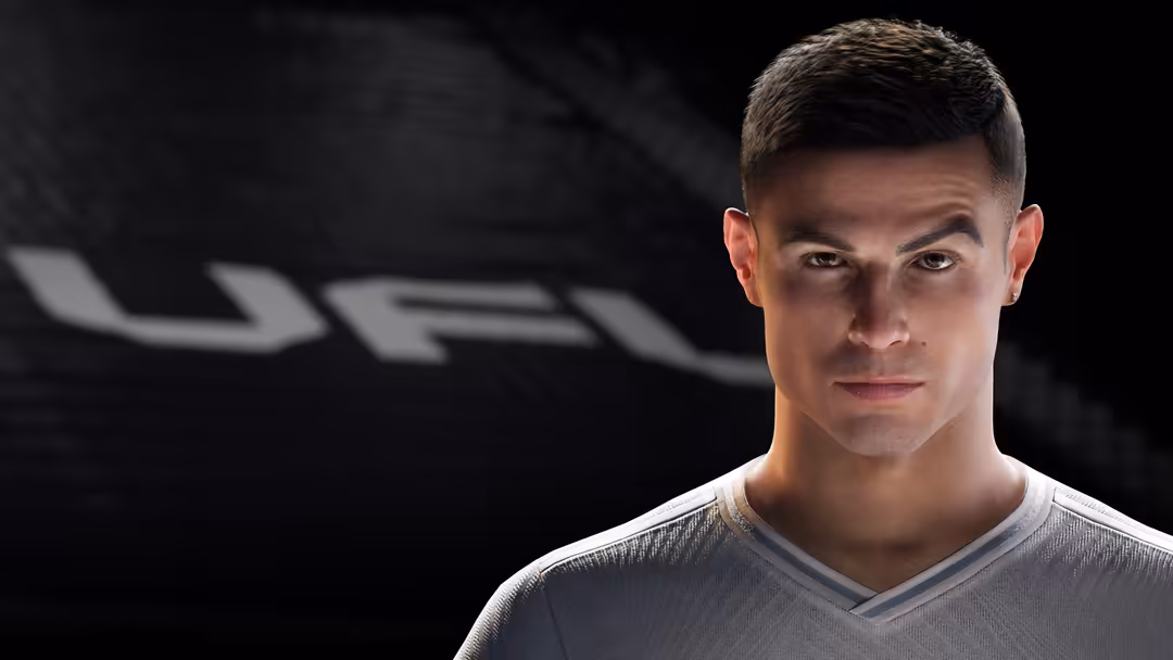 portrait of an athlete in a light gray v-neck shirt against a dark background with blurred geometric logo.