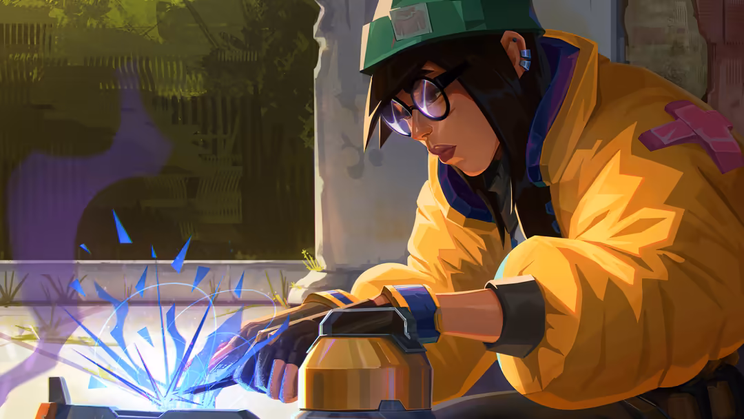 Killjoy from Valorant wearing yellow jacket and green cap, holding technological device with blue energy effects in industria