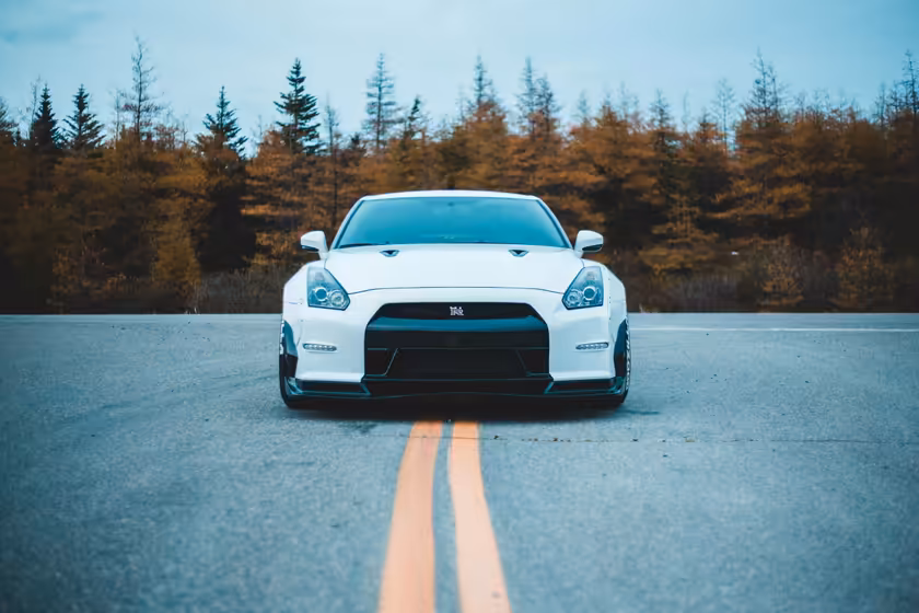 White Sports Car On Mountain Road