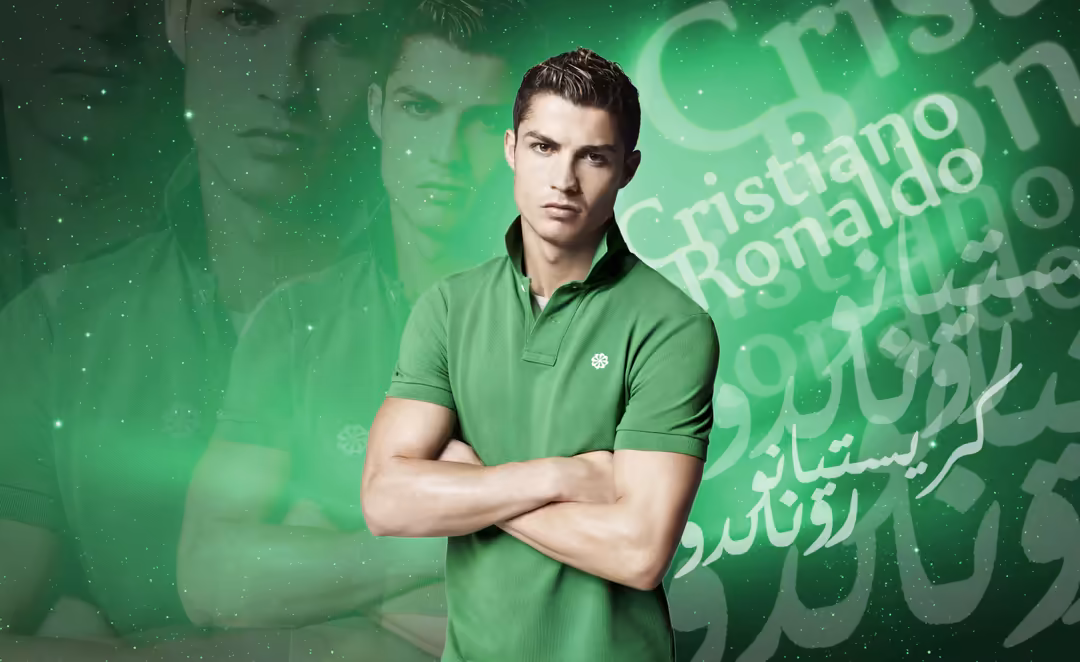 Person in green polo shirt with arms crossed stands against a bright green background with Arabic text and sparkling light…