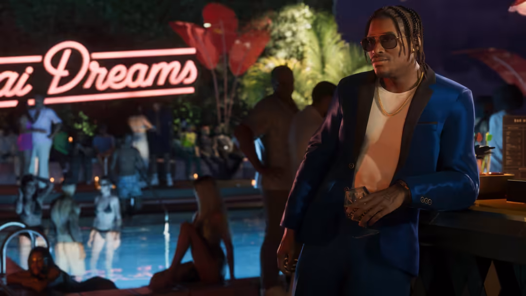 Man in blue blazer and sunglasses at neon-lit nightclub with 'Dreams' sign and dancing crowd in background