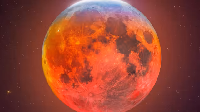 Blood Moon Rising in Starry Night