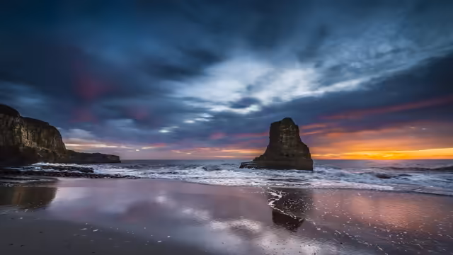 Rocky Coastal Sunset With Stone Arch