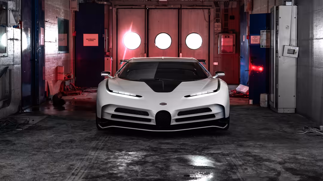 White Bugatti Centodieci hypercar parked in industrial garage with red neon lighting and circular light fixtures