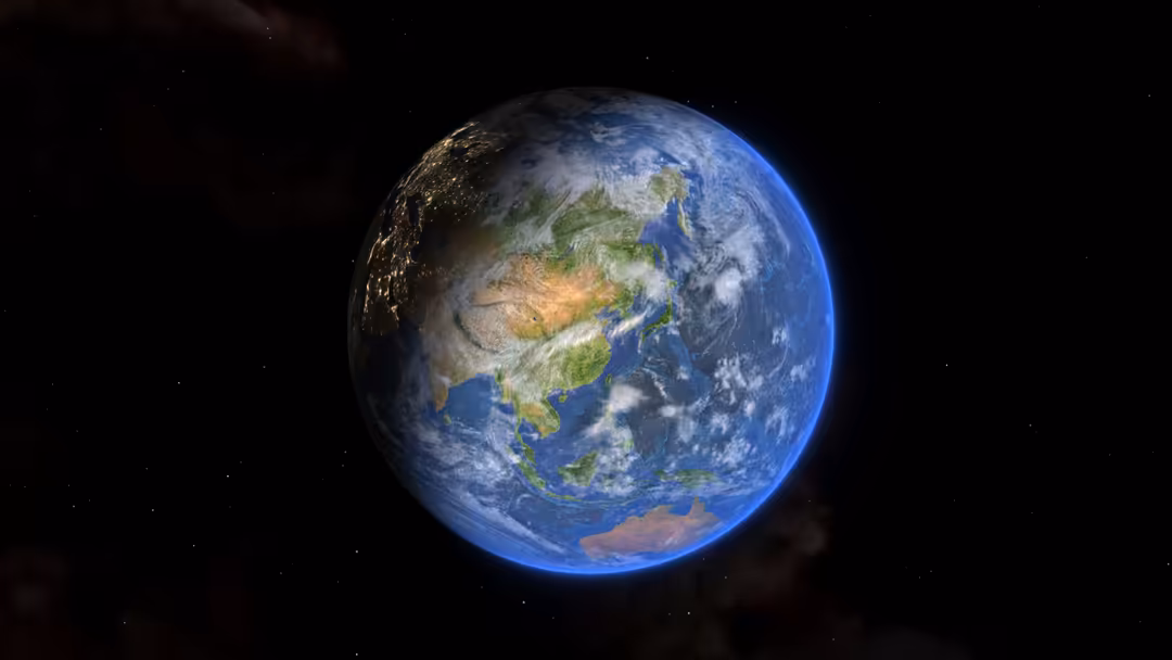 Earth globe suspended in space against starry black background, showing blue oceans, green continents, and white clouds.
