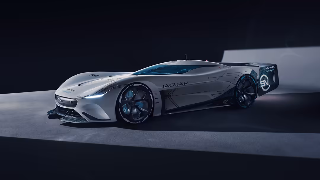 Sleek silver and blue Jaguar Vision Gran Turismo SV concept car with aerodynamic design, glowing blue wheels, displayed on mi