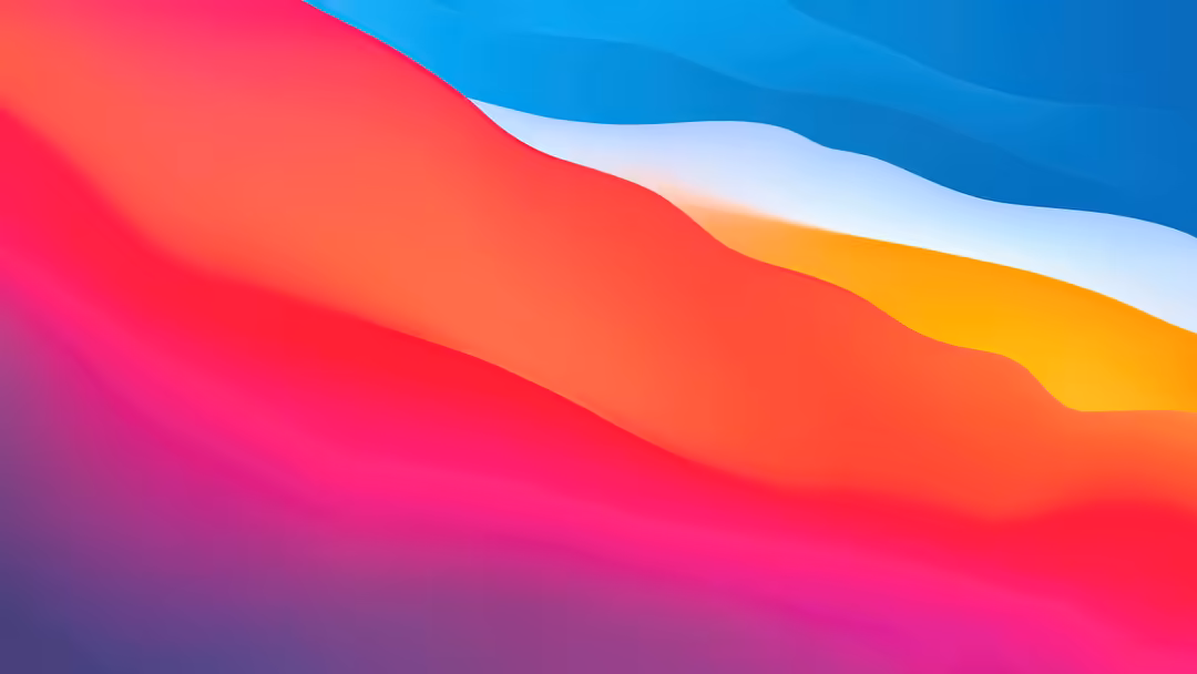 Vibrant abstract gradient waves flowing across the screen in pink, red, blue, yellow, and purple hues with smooth curved tran