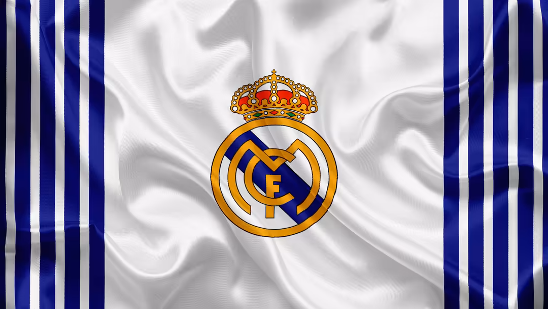 Real Madrid CF logo with gold crown and blue-white striped background, featuring the iconic club emblem