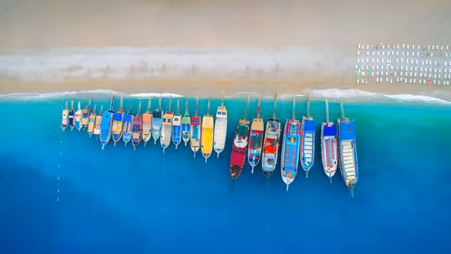Colorful Boats Moored In Turquoise Waters