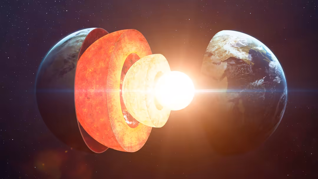 Scientific illustration of Earth's internal core structure with glowing red and yellow layers against a dark starry space bac