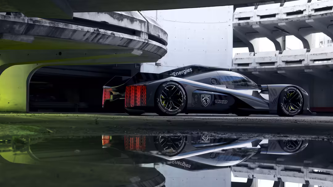 Sleek black Peugeot 9X8 hypercar with red taillights reflected in wet asphalt beneath urban overpass infrastructure